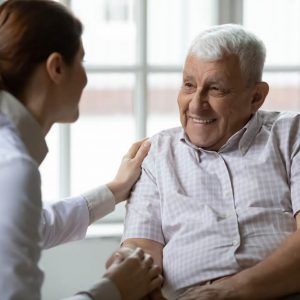 Lady comforting patient