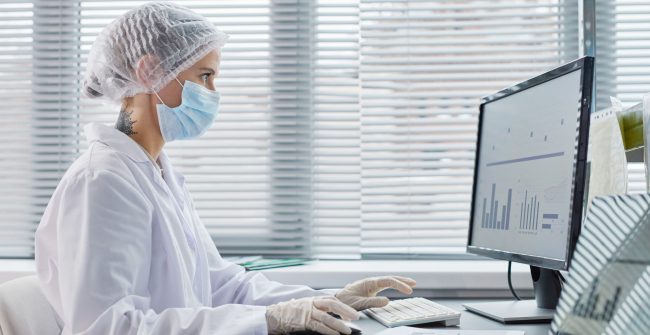 doctor-working-on-computer-at-office-2022-01-12-02-19-00-utc