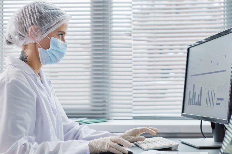 doctor-working-on-computer-at-office-2022-01-12-02-19-00-utc