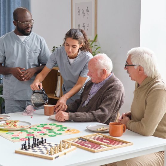 Nurse caring about senior people in nursing home