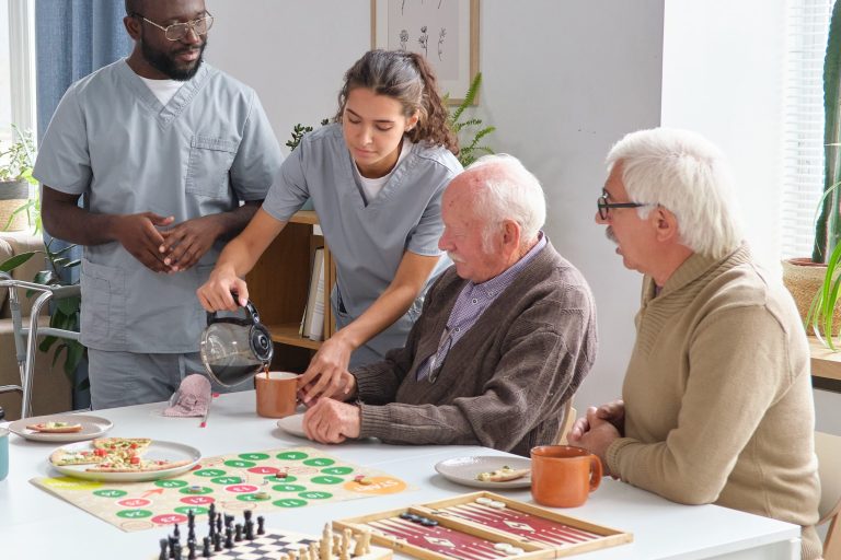 Nurse caring about senior people in nursing home