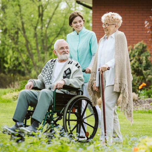 Senior man on the wheelchair in the garden of professional nursing home