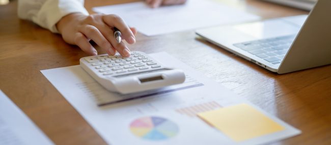 Businesswoman Accountant analyzing investment charts Invoice and