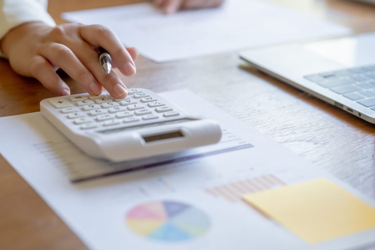 Businesswoman Accountant analyzing investment charts Invoice and