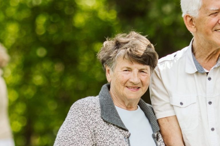 Elder people with the caregiver in the garden