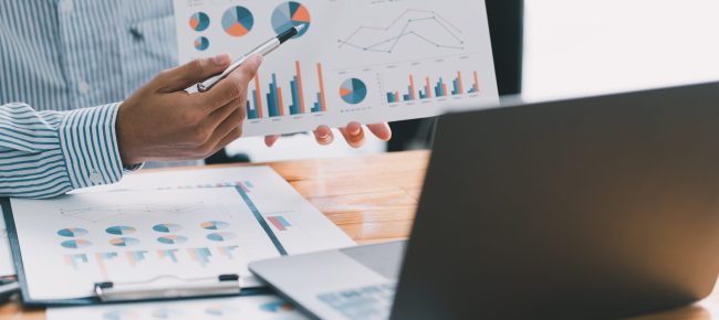 Financial businessman calculating corporate income tax data And