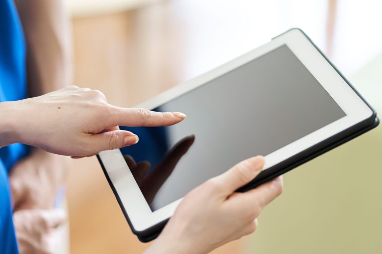 caregiver-viewing-materials-on-tablet-2023-07-05-22-44-35-utc (1)