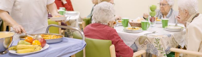 cook-serving-food-to-seniors-in-a-geriatric-2024-04-01-20-59-01-utc