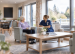 Nurse sitting with resident in a rest home environment